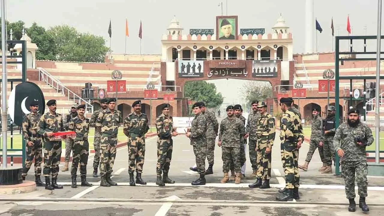 Pakistani, Indian border forces exchange sweets on Eid