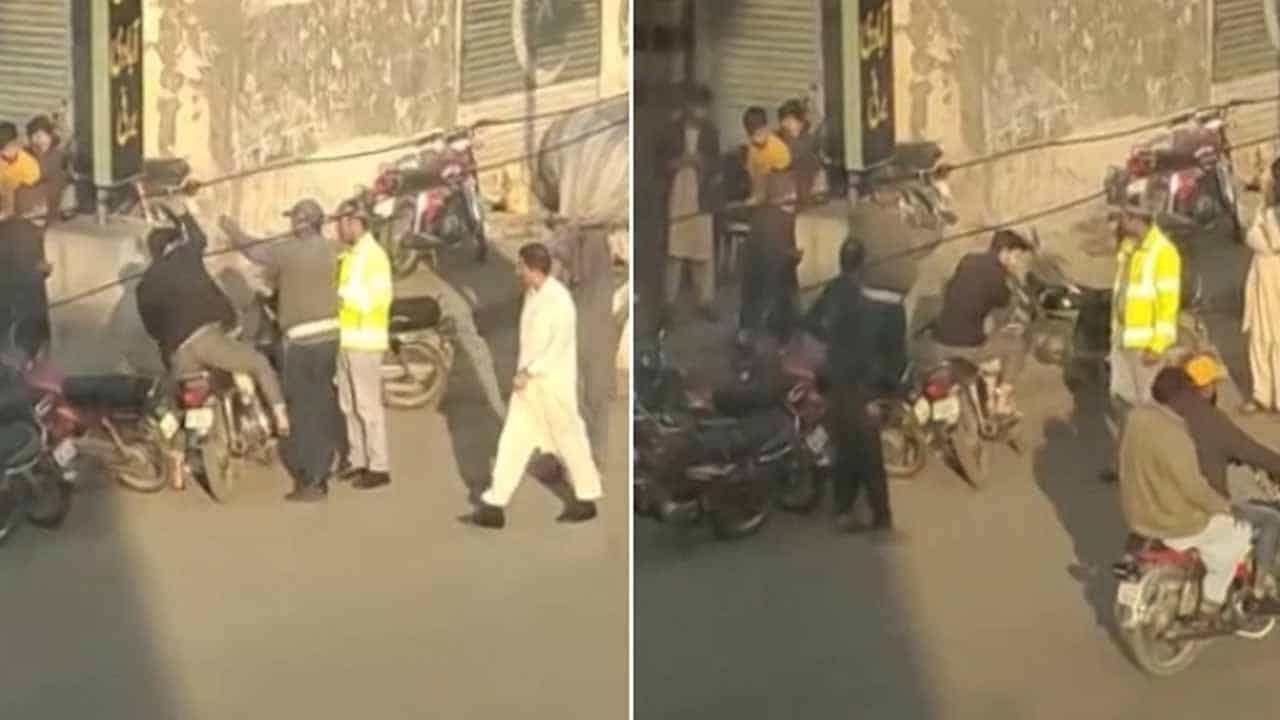 Lahore traffic cop caught slapping, and humiliating young biker