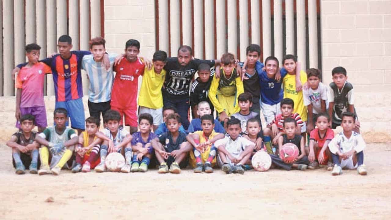 England’s football club sends a coach to train young players in Karachi’s Lyari town