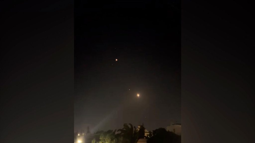 Flashes are seen in the sky over Amman, Jordan, early Sunday, local time. Obtained by CNN
